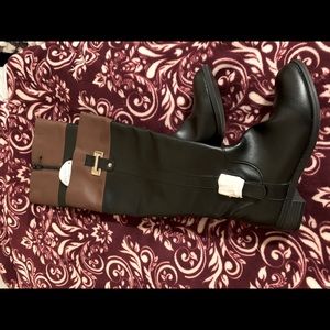 Black boots with brown and gold accessories